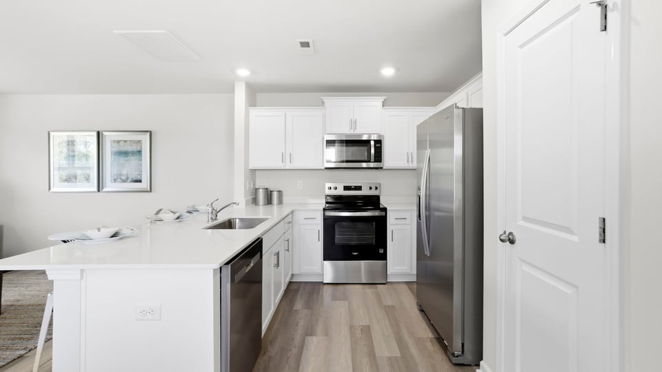 Kitchen with quartz countertops and stainless steel appliances