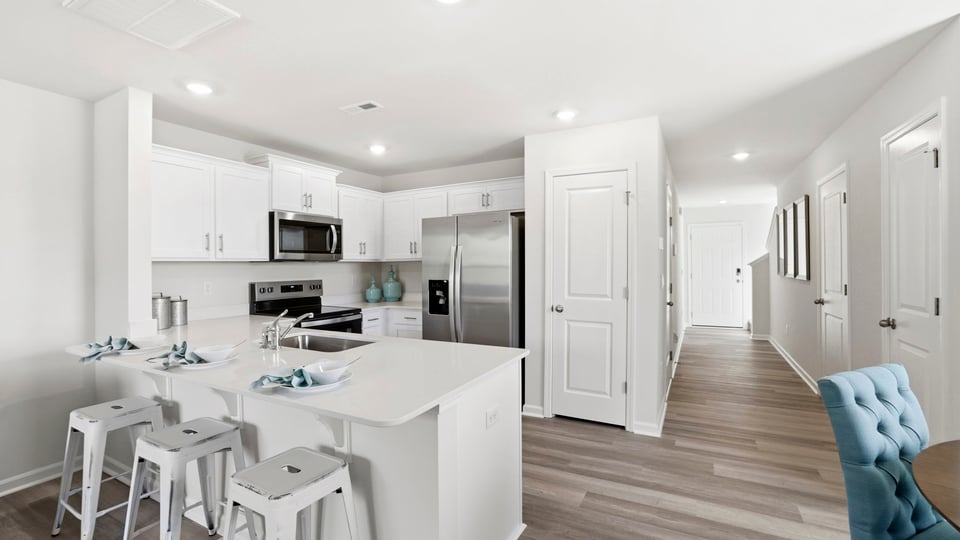 Kitchen with quartz countertops and stainless steel appliances