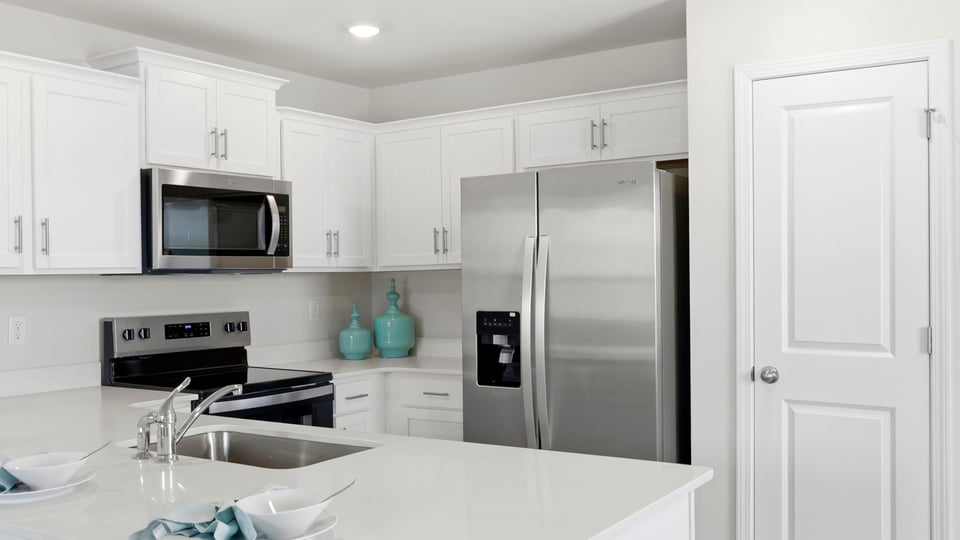 Kitchen with quartz countertops and stainless steel appliances