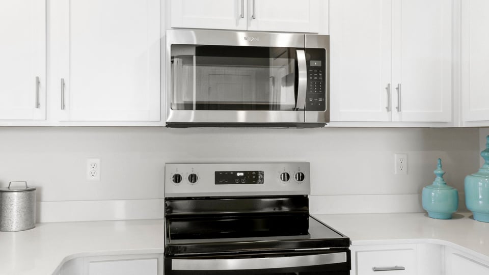 Kitchen with quartz countertops and stainless steel appliances