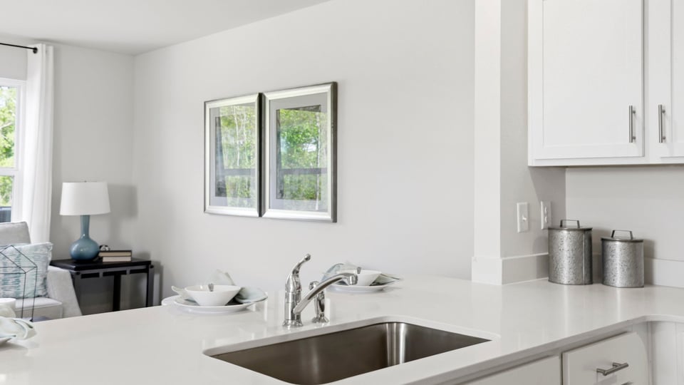 Kitchen with quartz countertops and stainless steel appliances