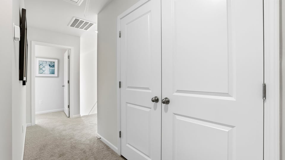 Hallway with carpet.