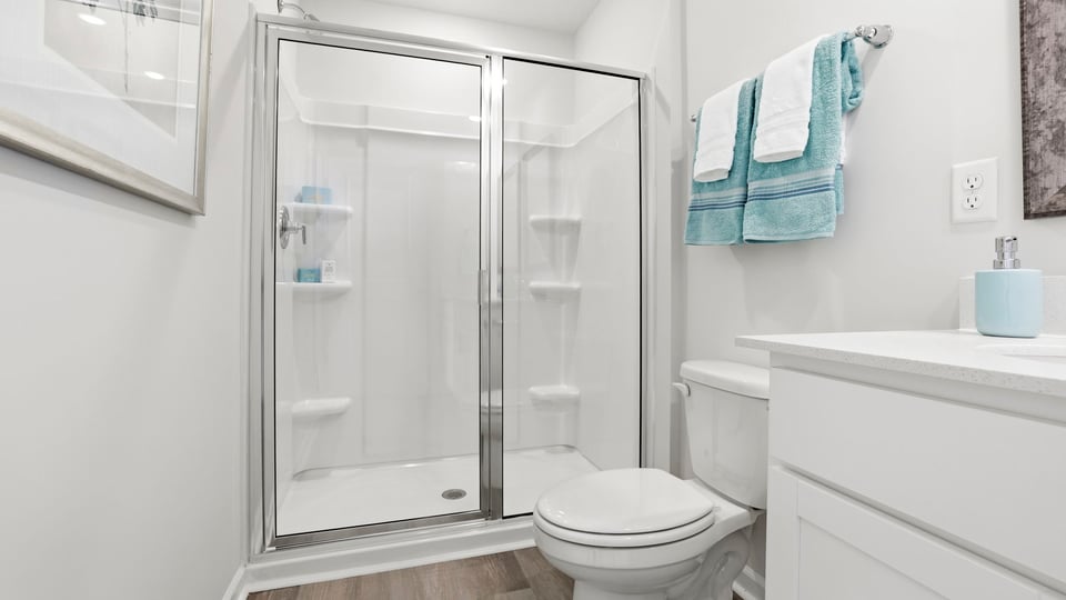Bathroom with walk in shower.