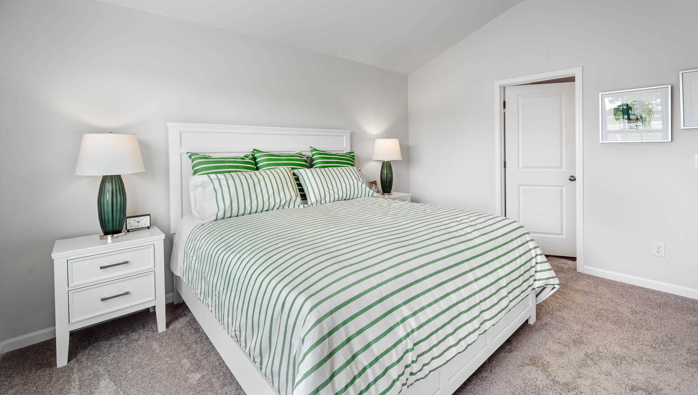 Bedroom with carpet and window.