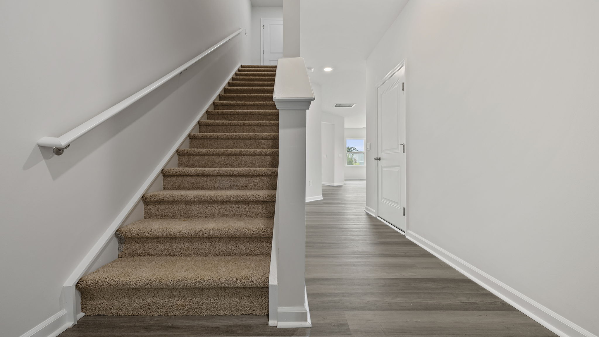 View of staircase and hallway to the living area.