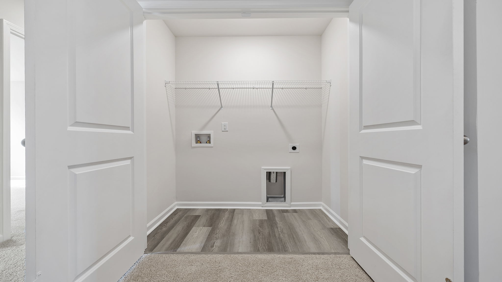 Laundry room with shelving.