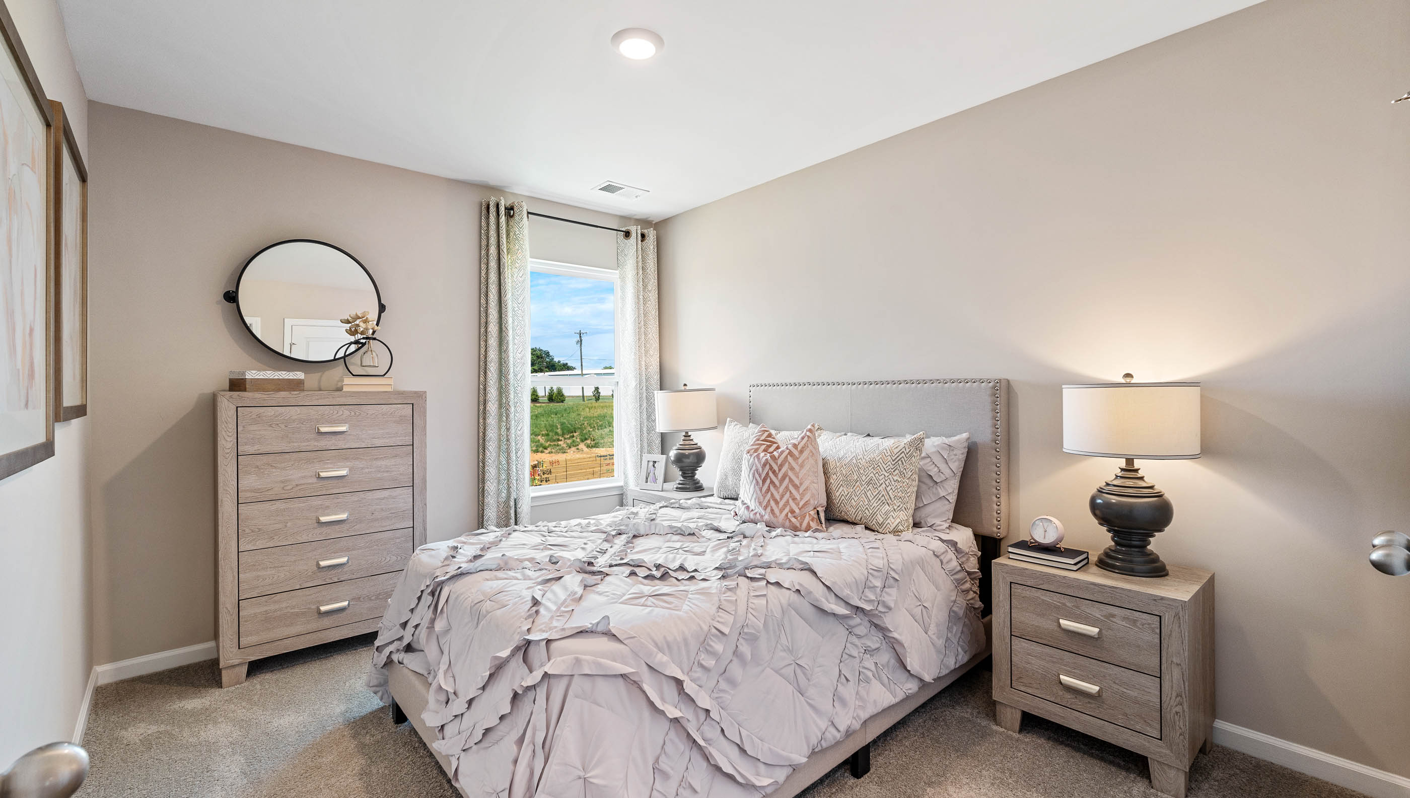Bedroom with carpet and windows.