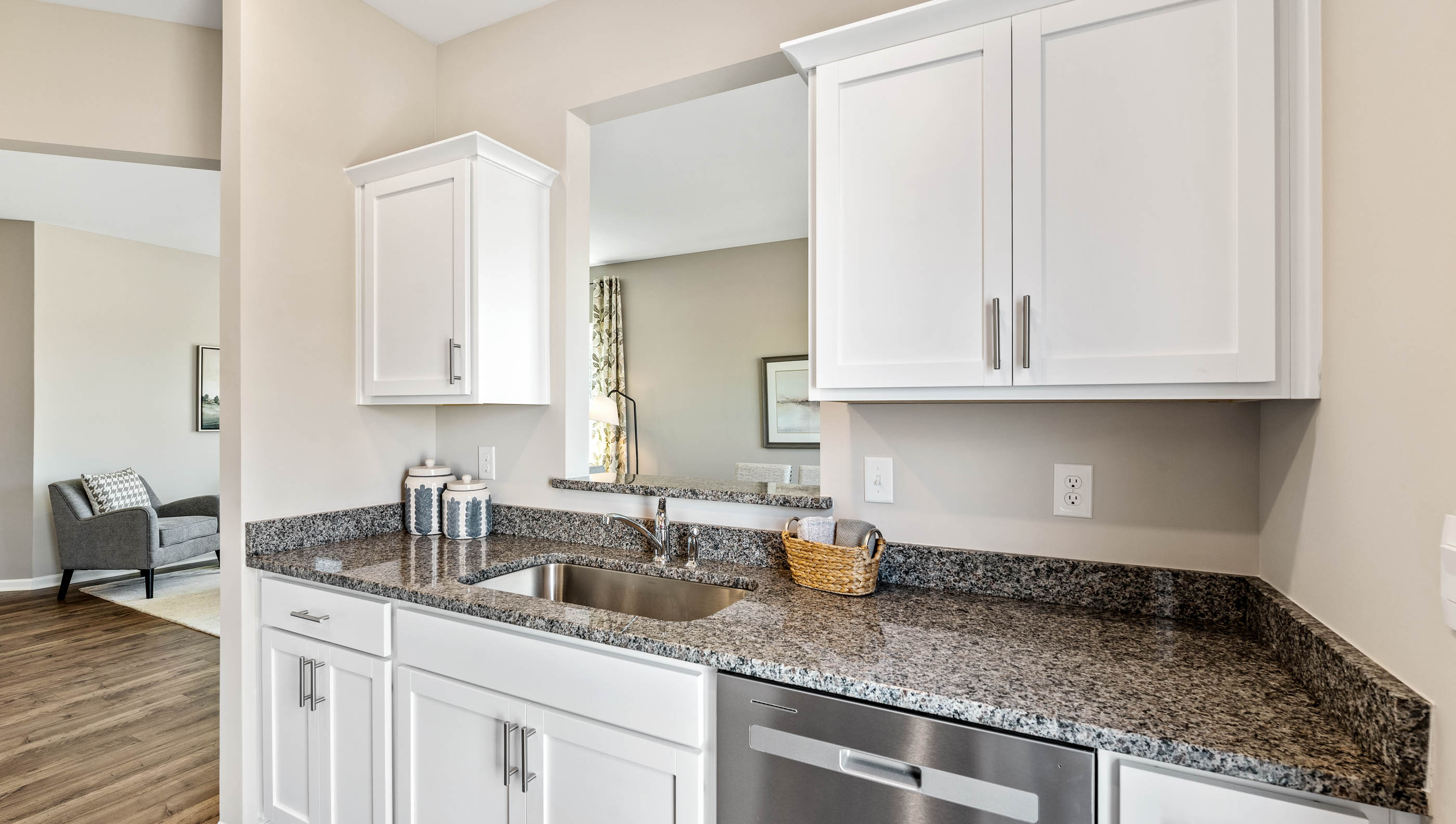 Kitchen with window and cabinets.