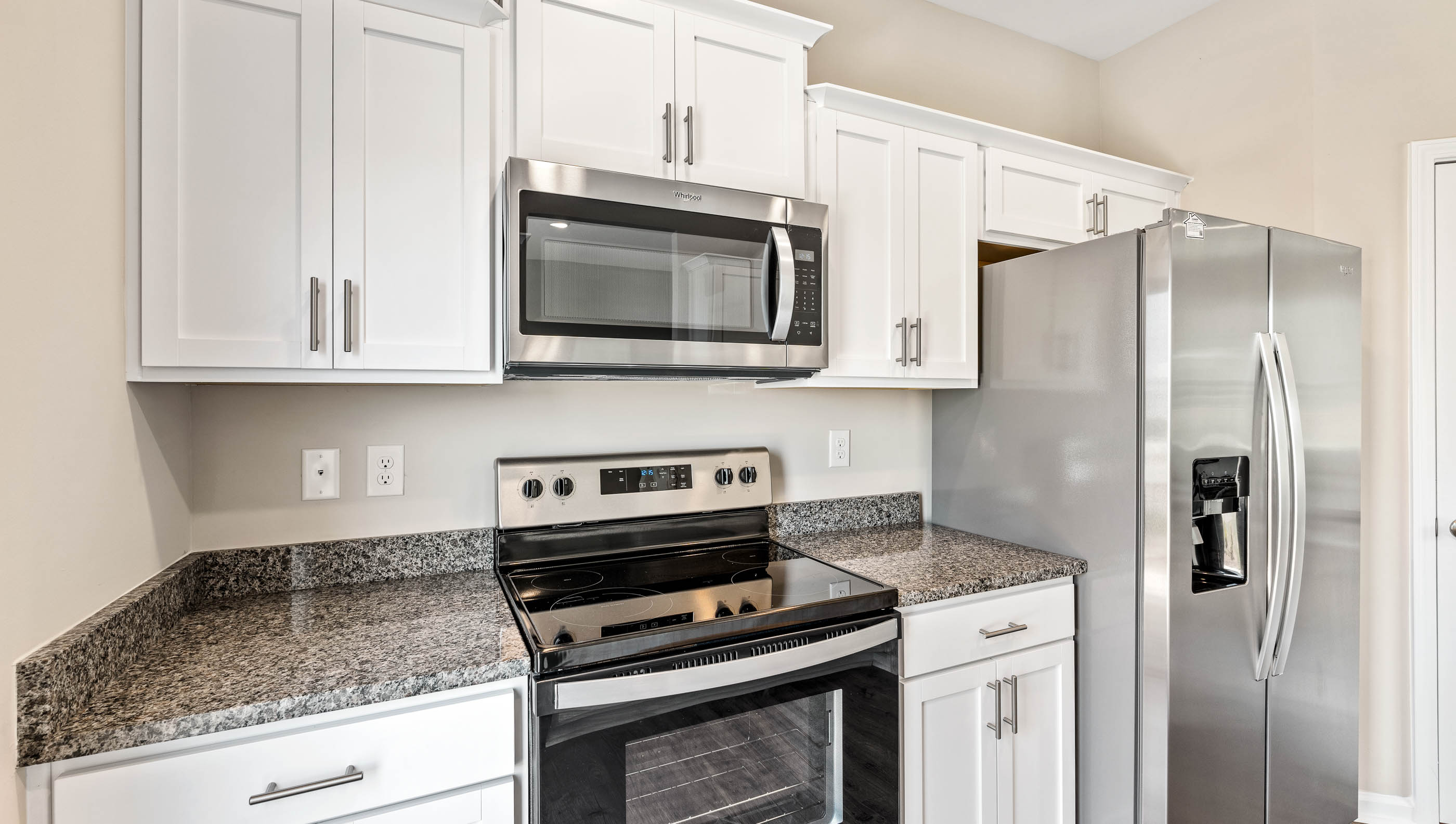 Kitchen with window and cabinets.