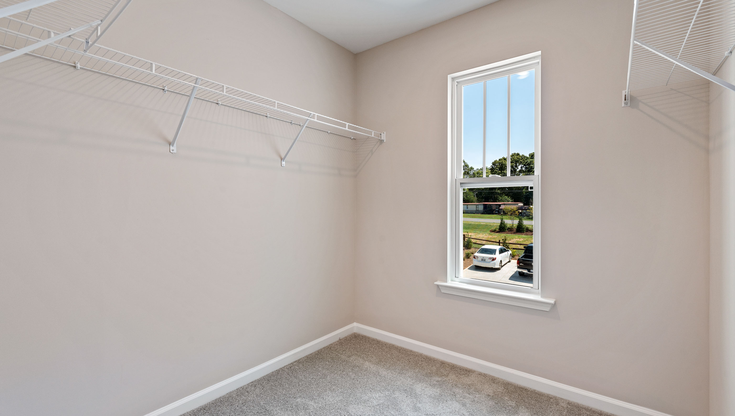 Primary closet with window.
