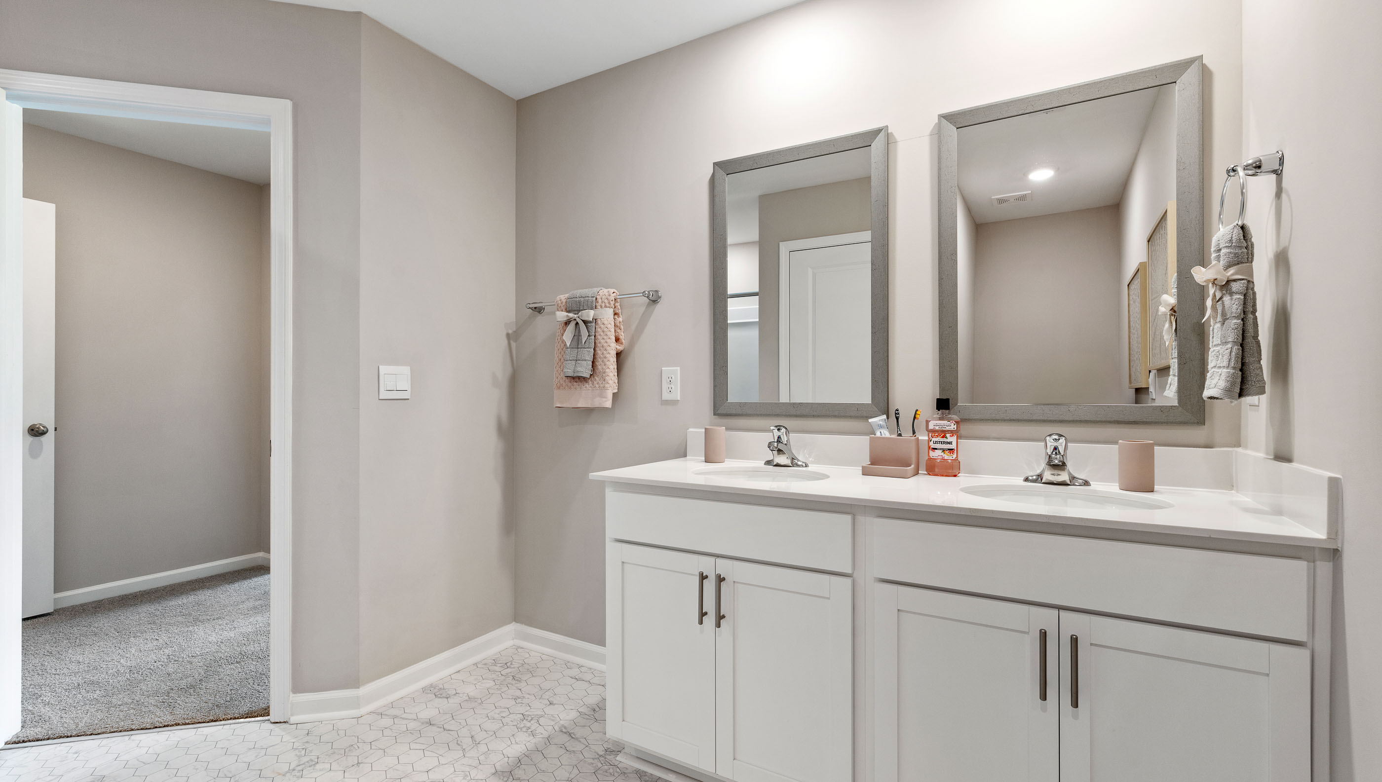 Primary bathroom with double vanity sinks.