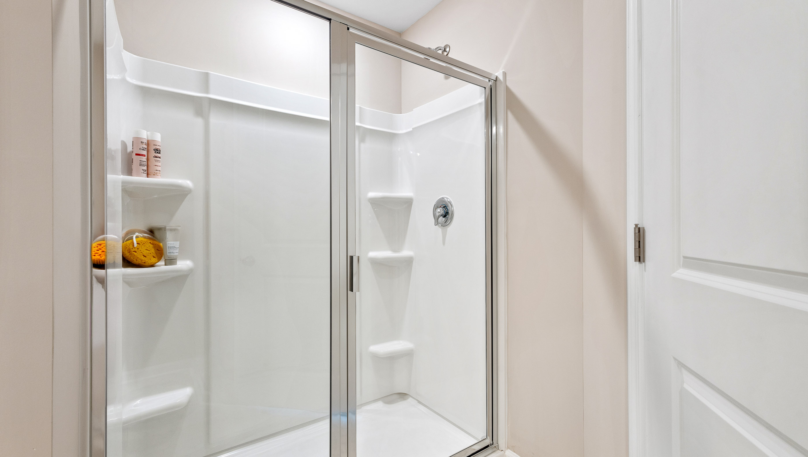 Primary bathroom with double vanity sinks.