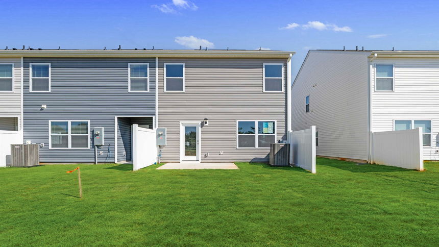 Back exterior with large backyard.