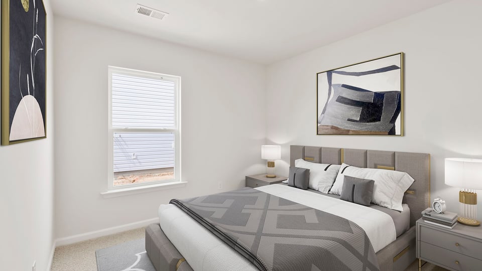 Bedroom with carpet and windows.