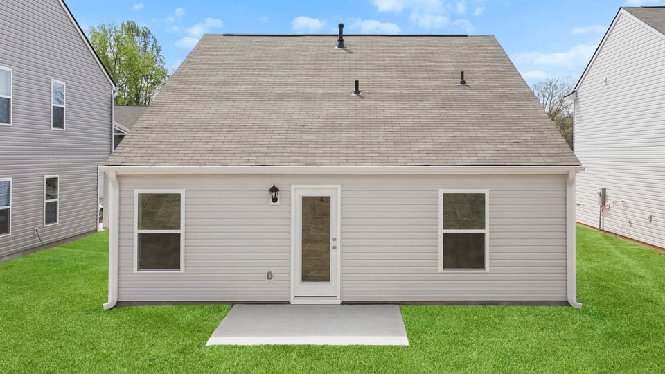 Back exterior with large backyard.