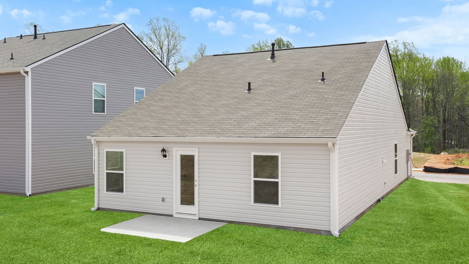 Back exterior with large backyard.