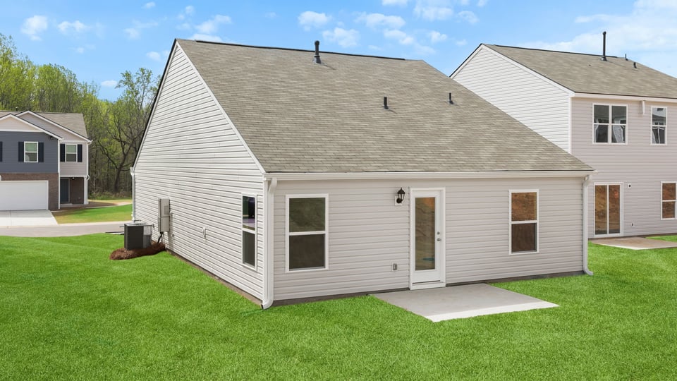 Back exterior with large backyard.