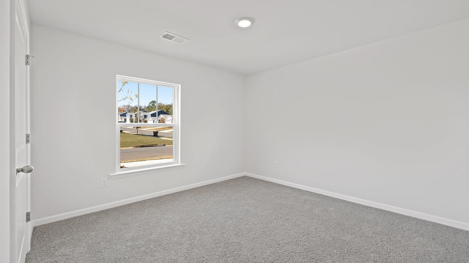 View of hallway, bathroom and bedroom on each side.