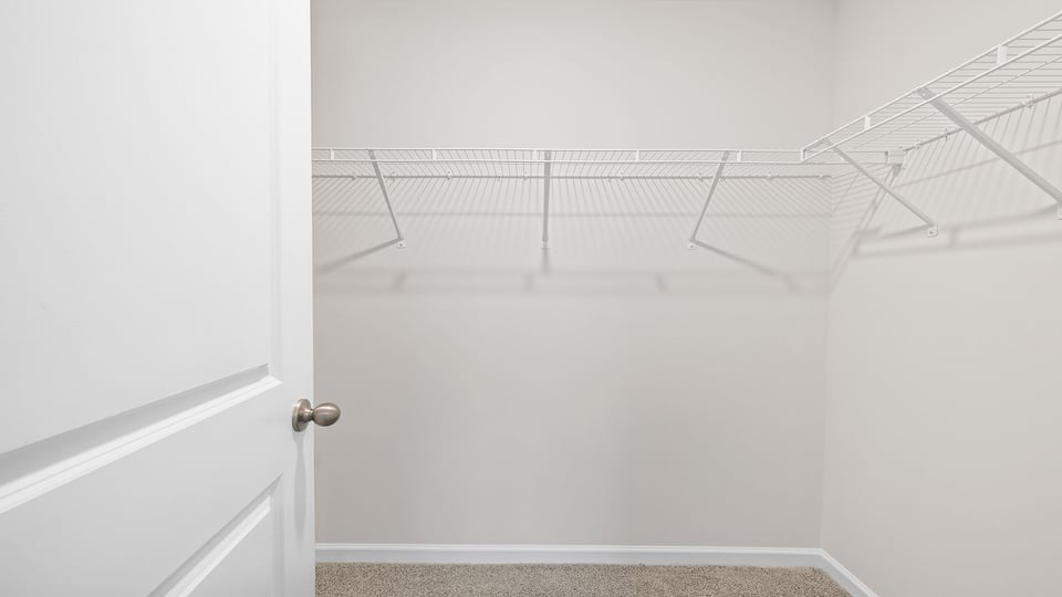 Primary bedroom walk-in closet.