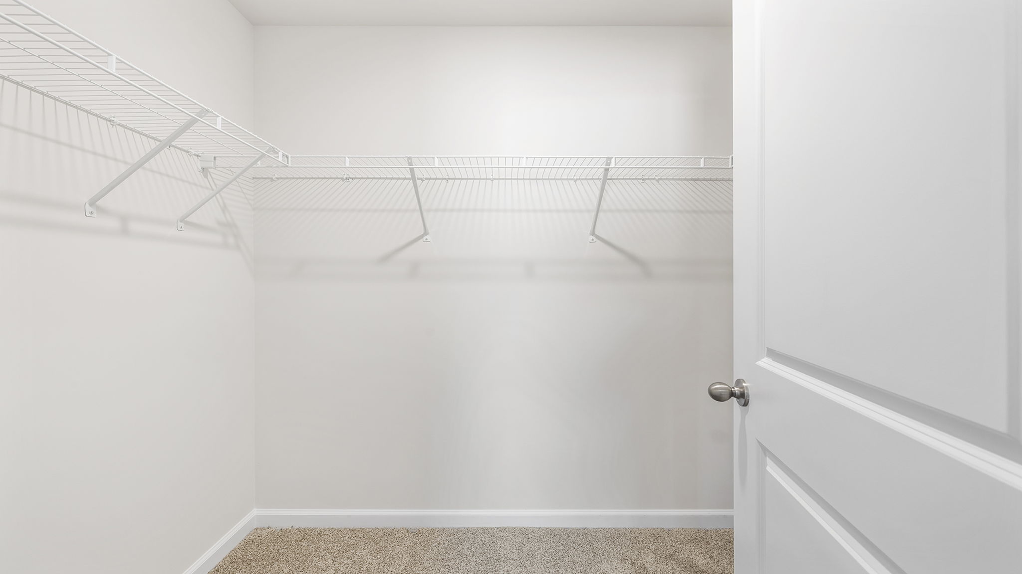 Primary bedroom walk-in closet.