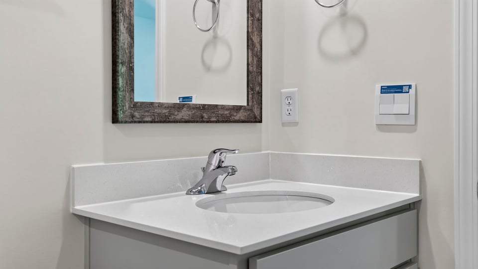 Primary bathroom with vanity sinks.