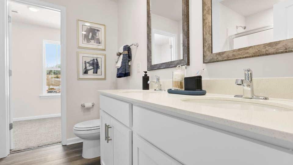 Primary bathroom with double vanity sinks.
