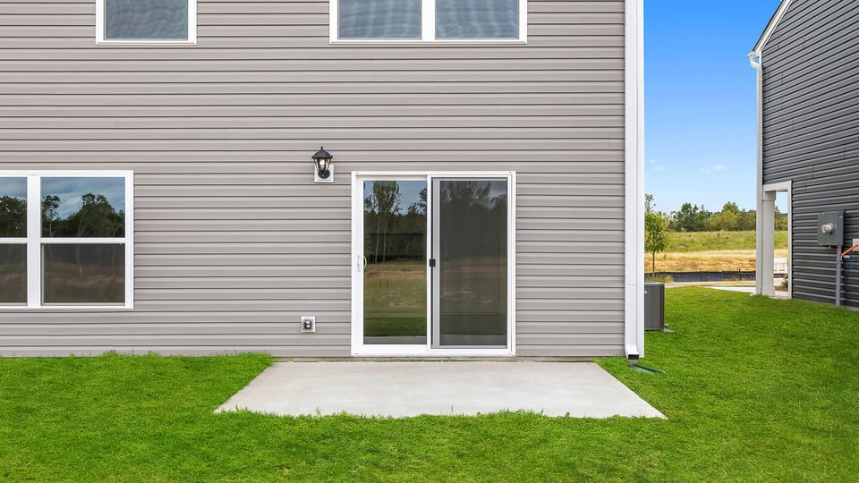 Back exterior with large backyard.