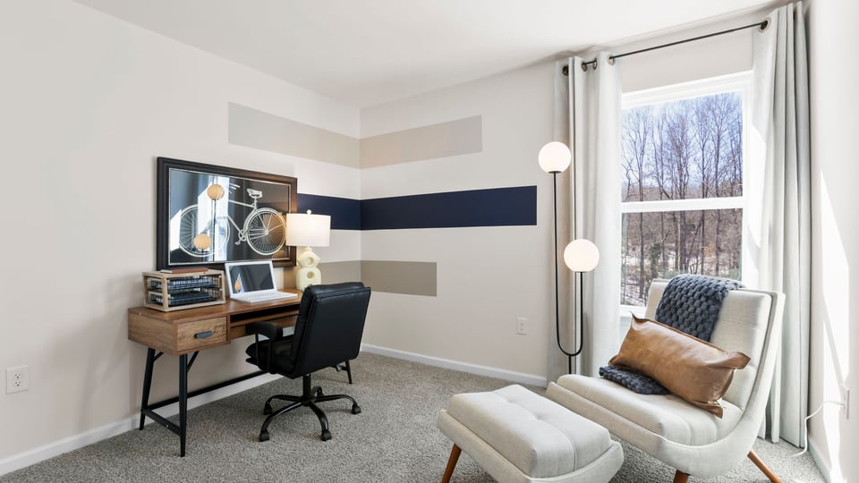 Bedroom with carpet and windows.