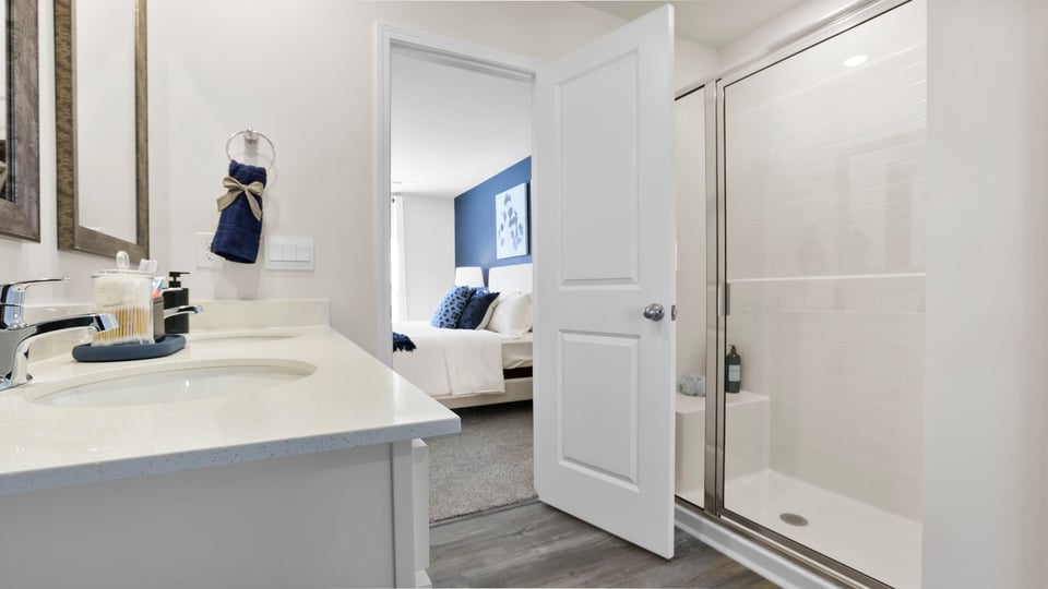 Primary bathroom with double vanity sinks.