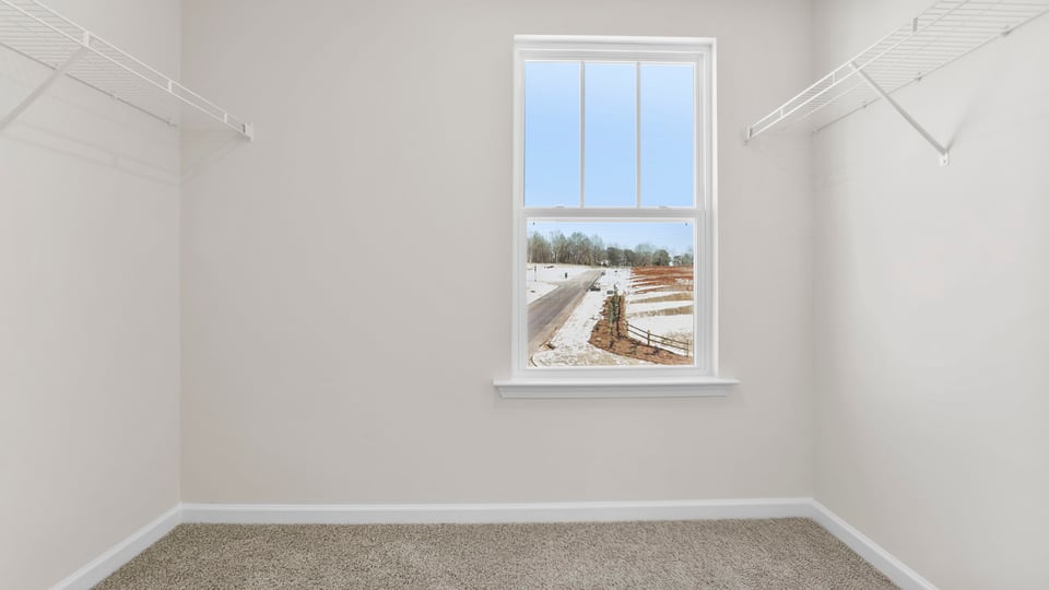 Primary closet with window.