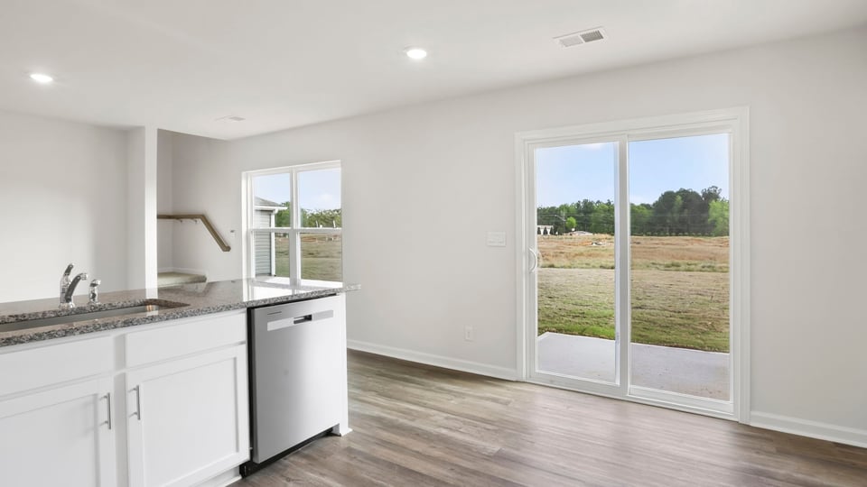 Kitchen with cabinet and window.