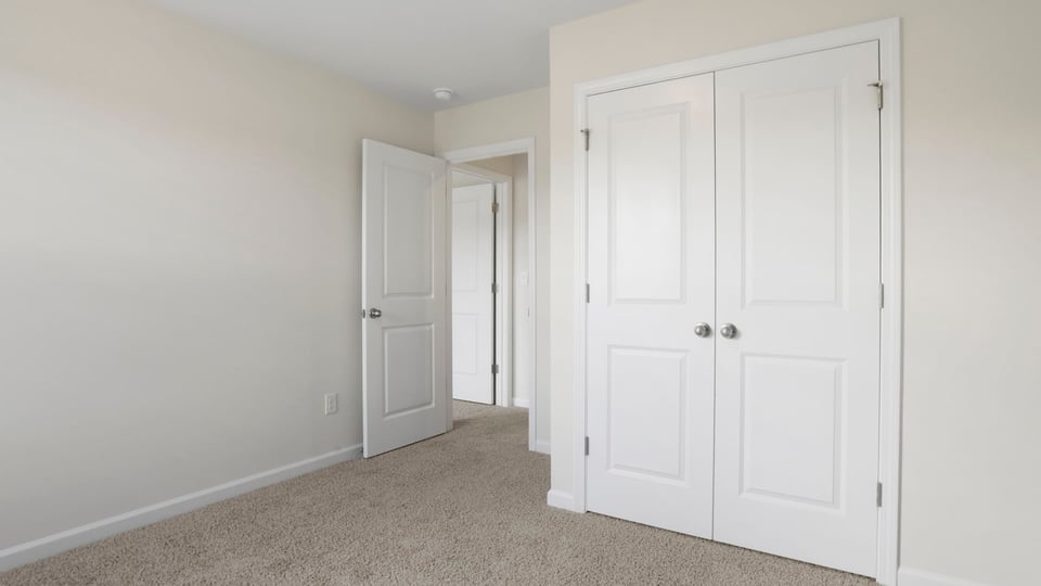 Bedroom with carpet and window,