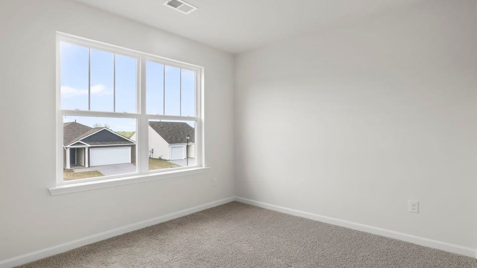 Bedroom with carpet and window,