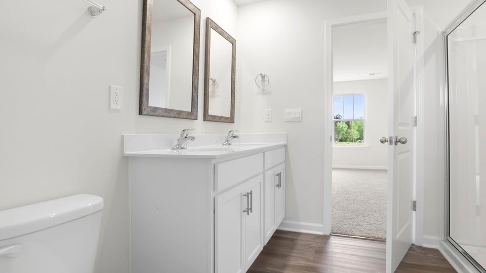 Primary bathroom with double vanity sinks.