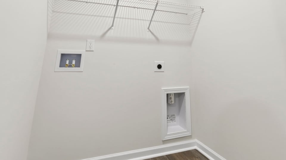 Laundry room with shelf.