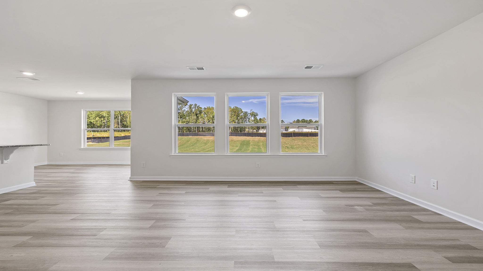 Open floor plan with lots of windows.