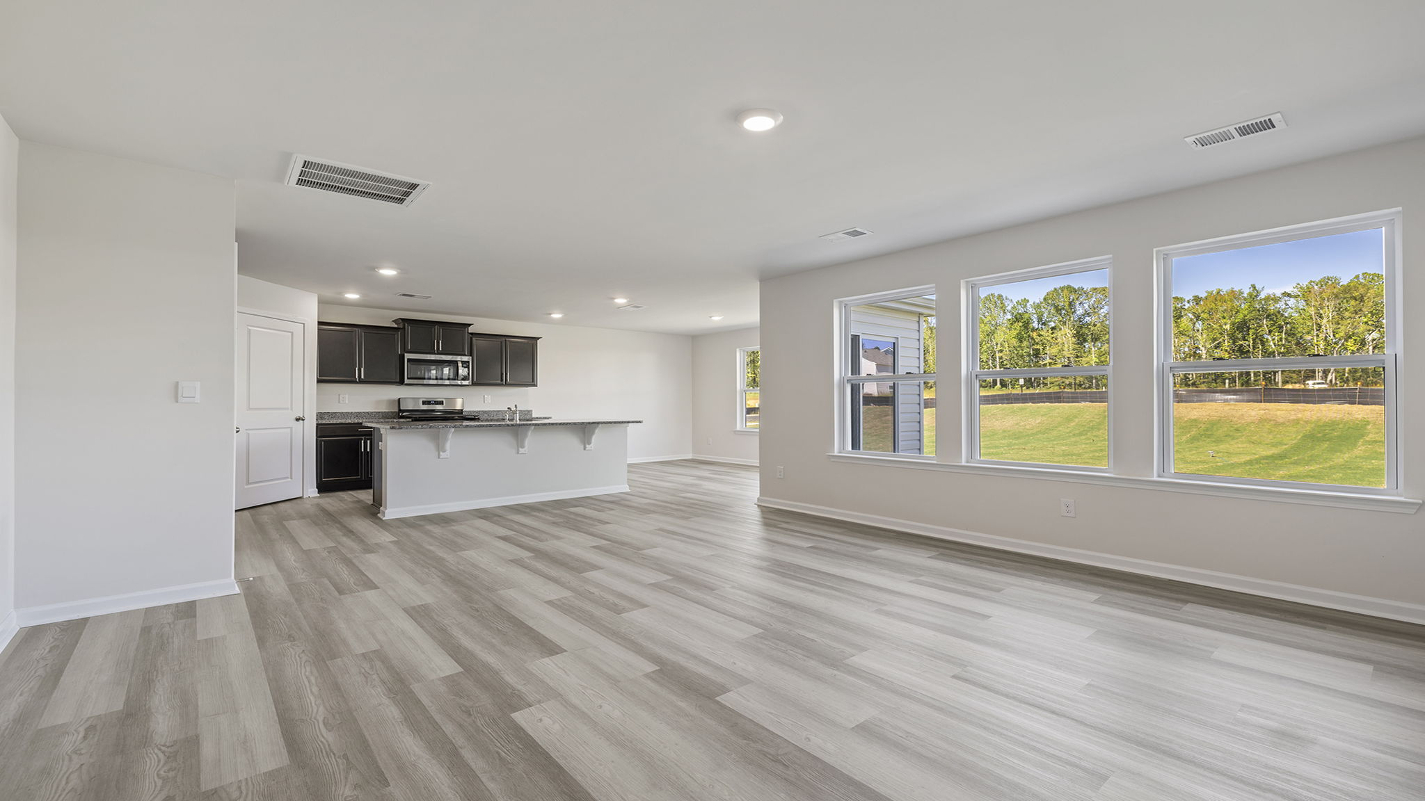 Open floor plan with lots of windows.