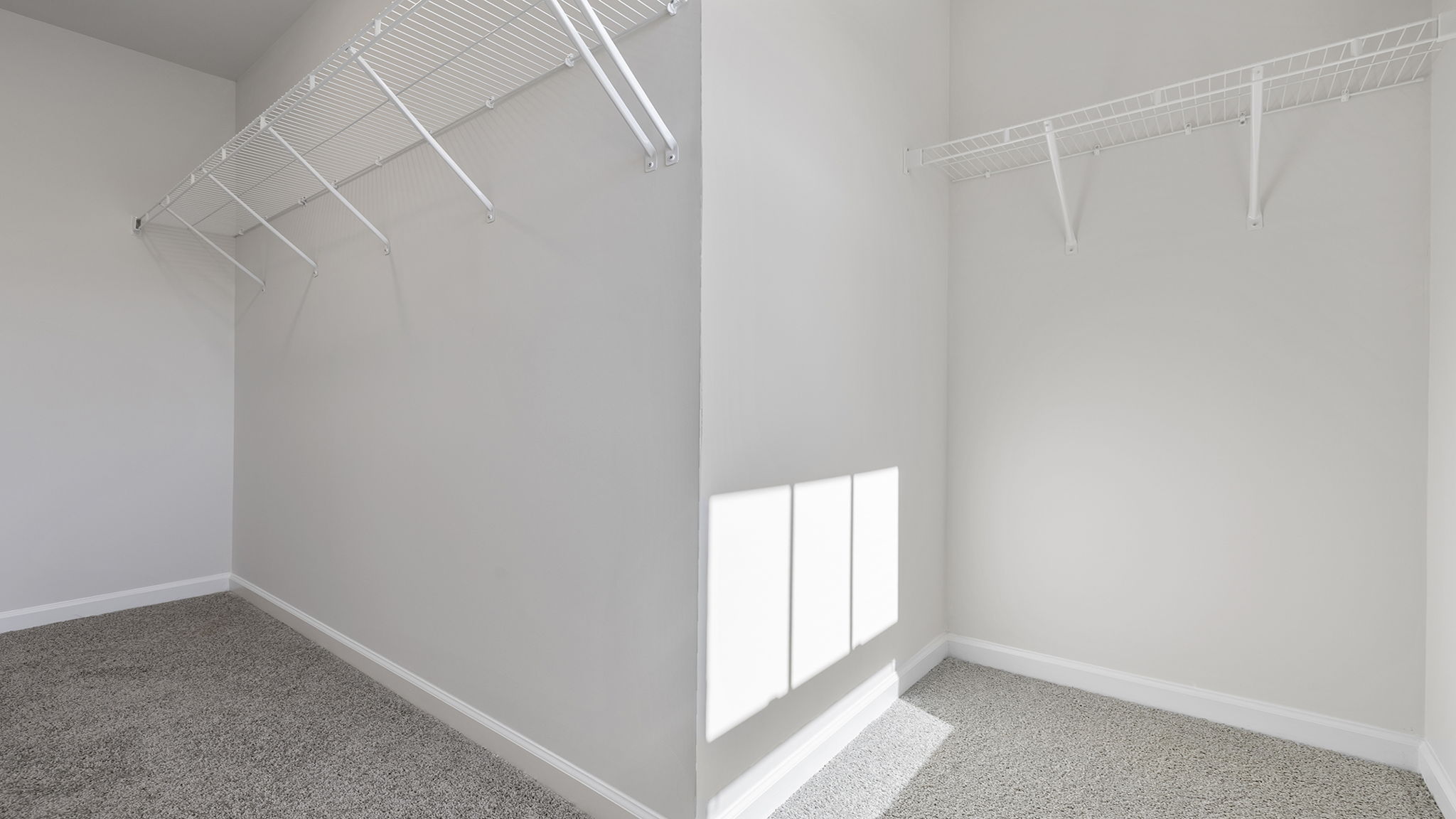 Primary bedroom walk-in closet.