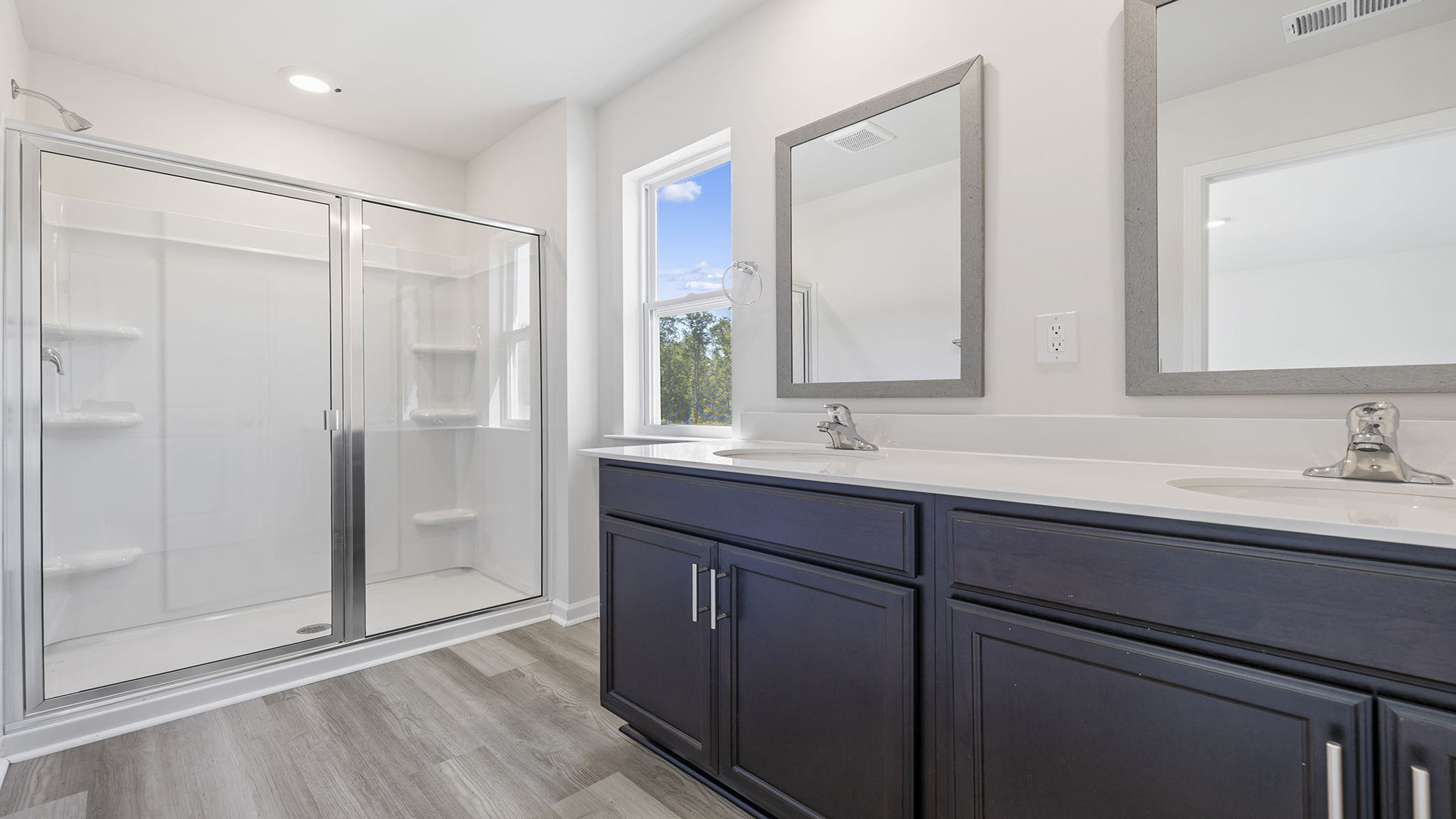 Primary bathroom with walk-in shower.
