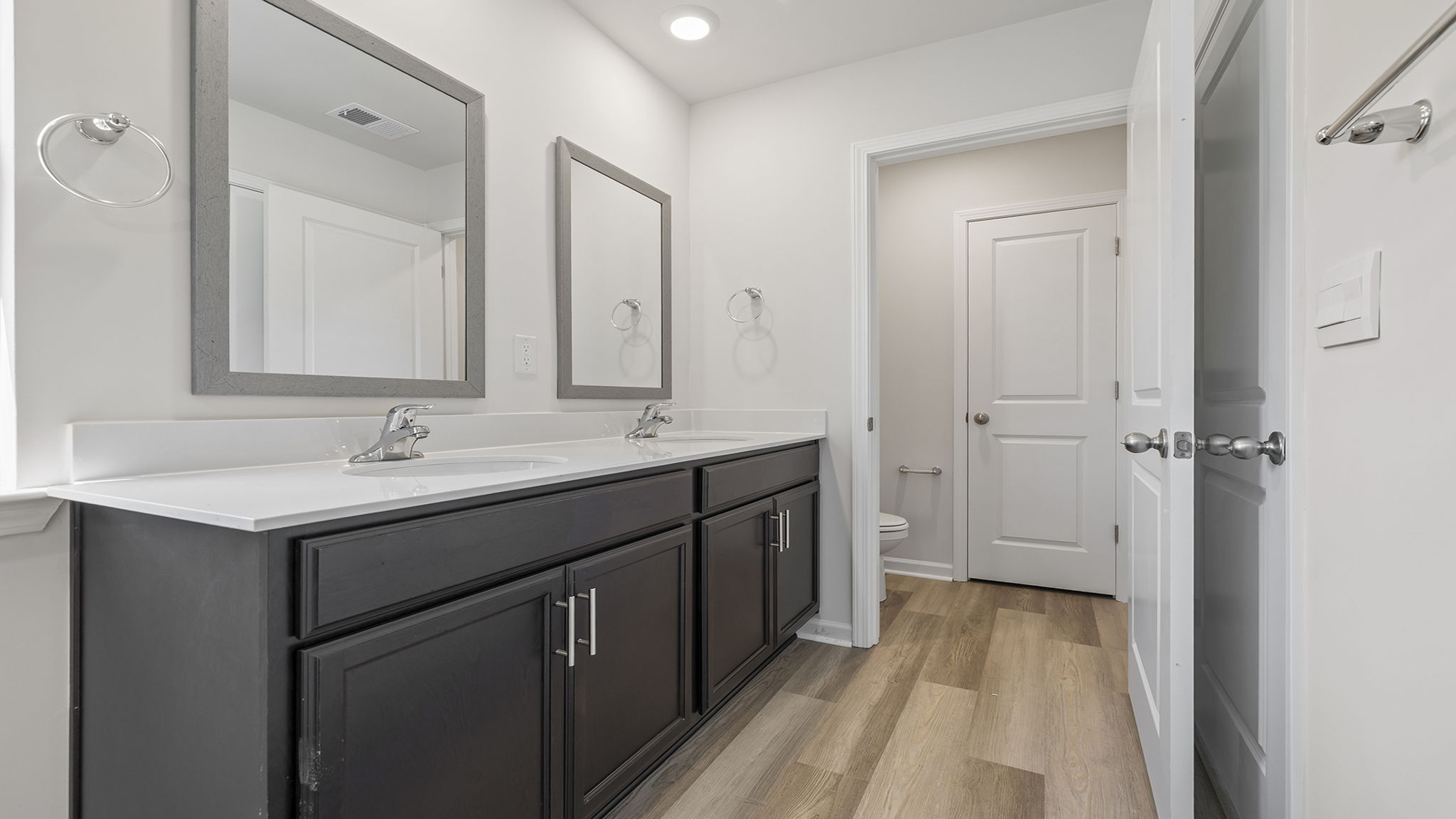 Primary bathroom with dual sink vanity.