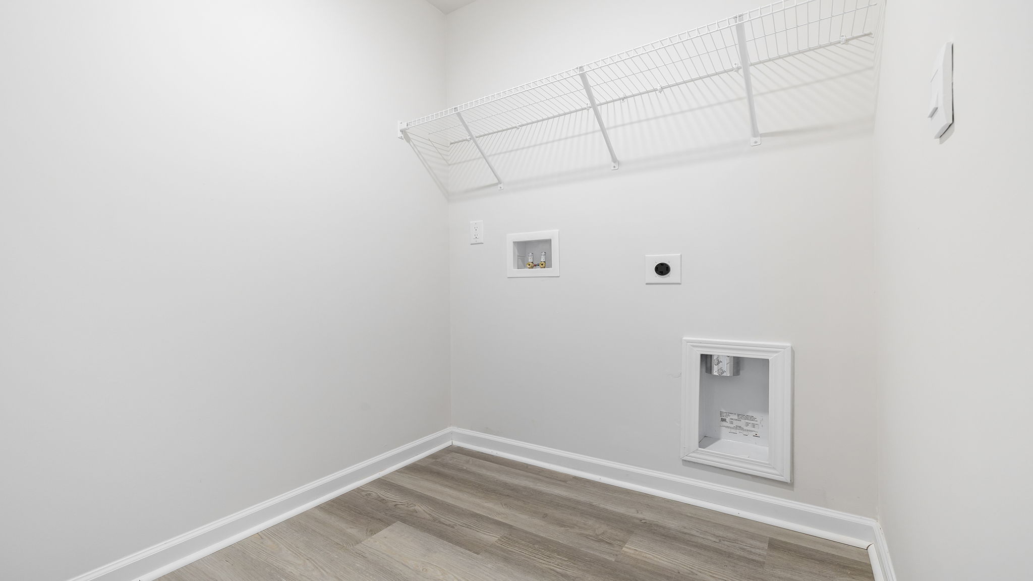 Laundry room with shelving.