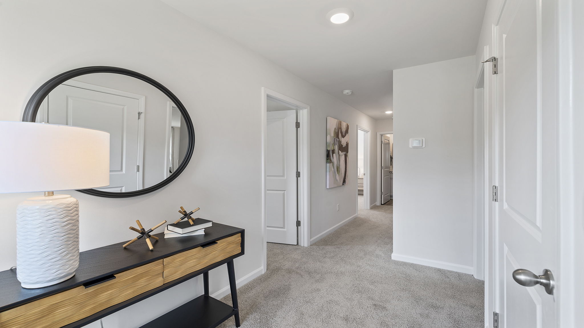 Top of stairs with carpet.