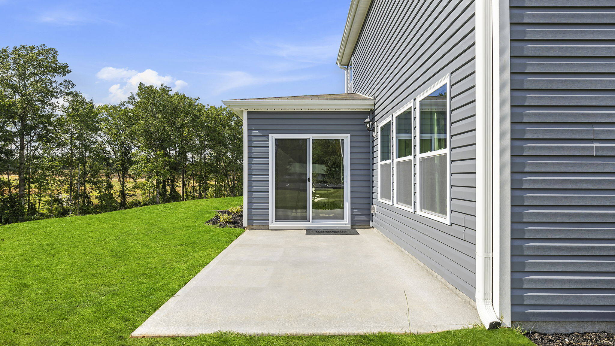 Back exterior with large backyard.