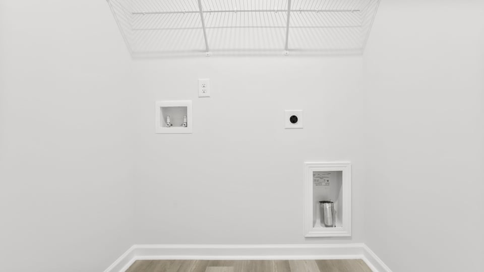 Laundry room with shelf.