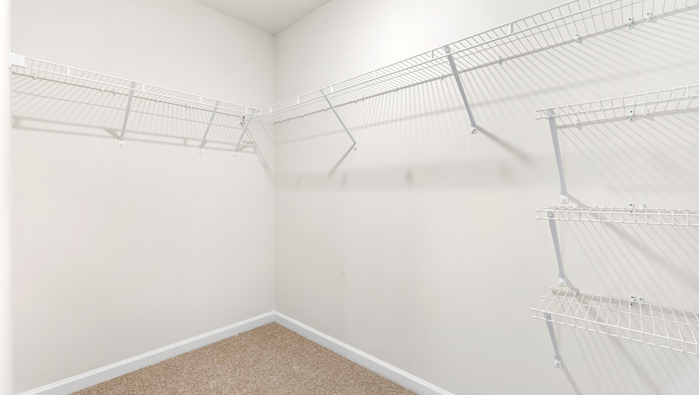 Primary bedroom walk in closet.