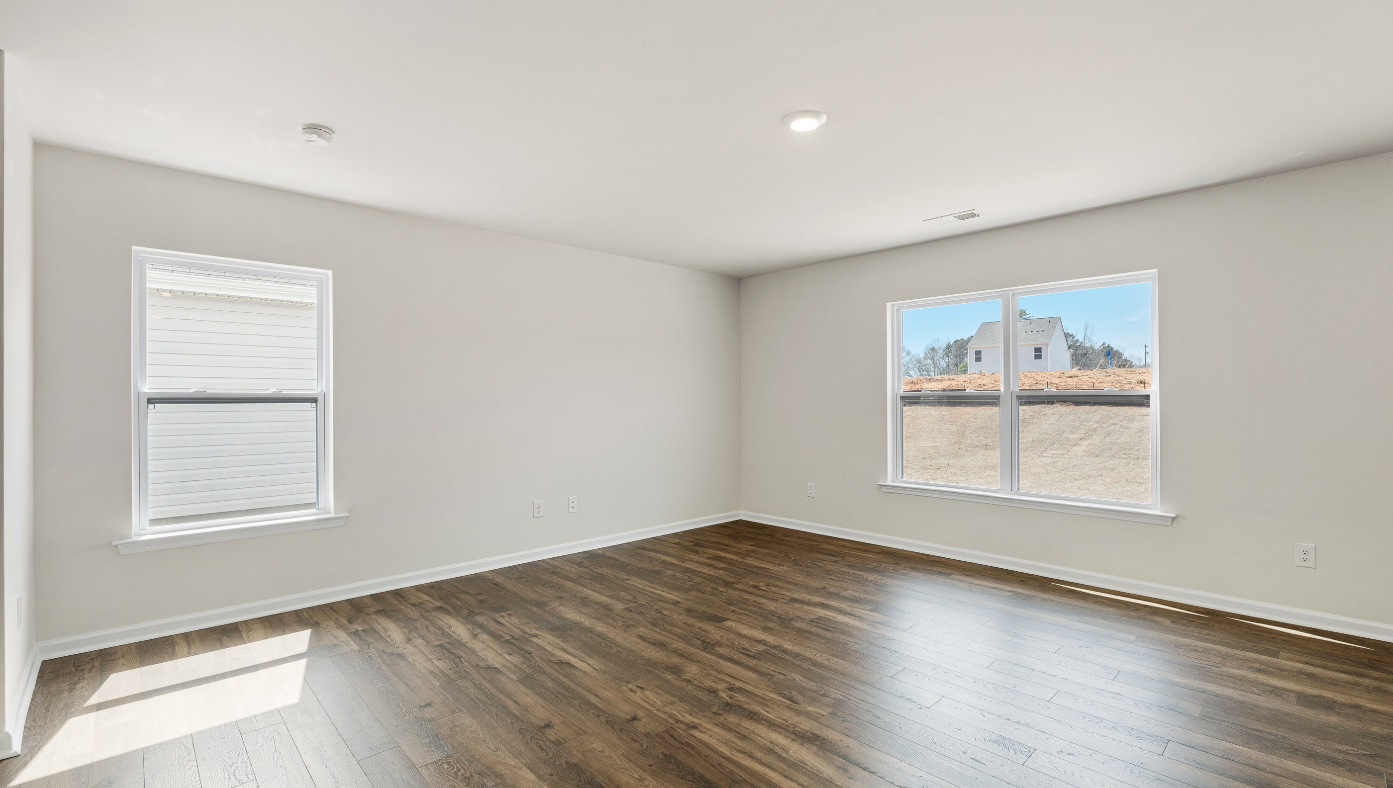 Living area with large windows.