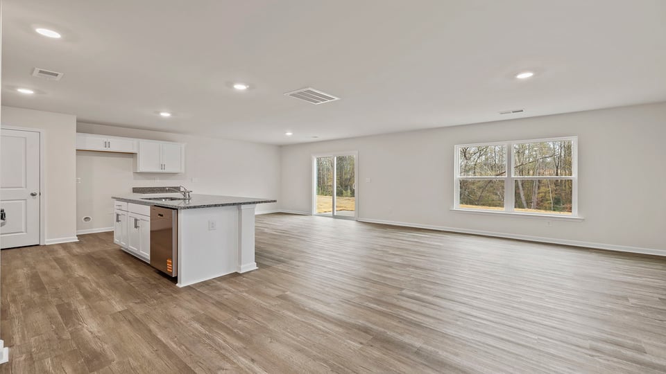 Kitchen and island with granite counter tops.