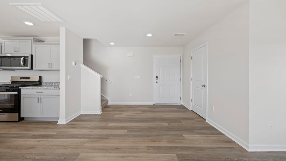 Foyer and view of kitchen.