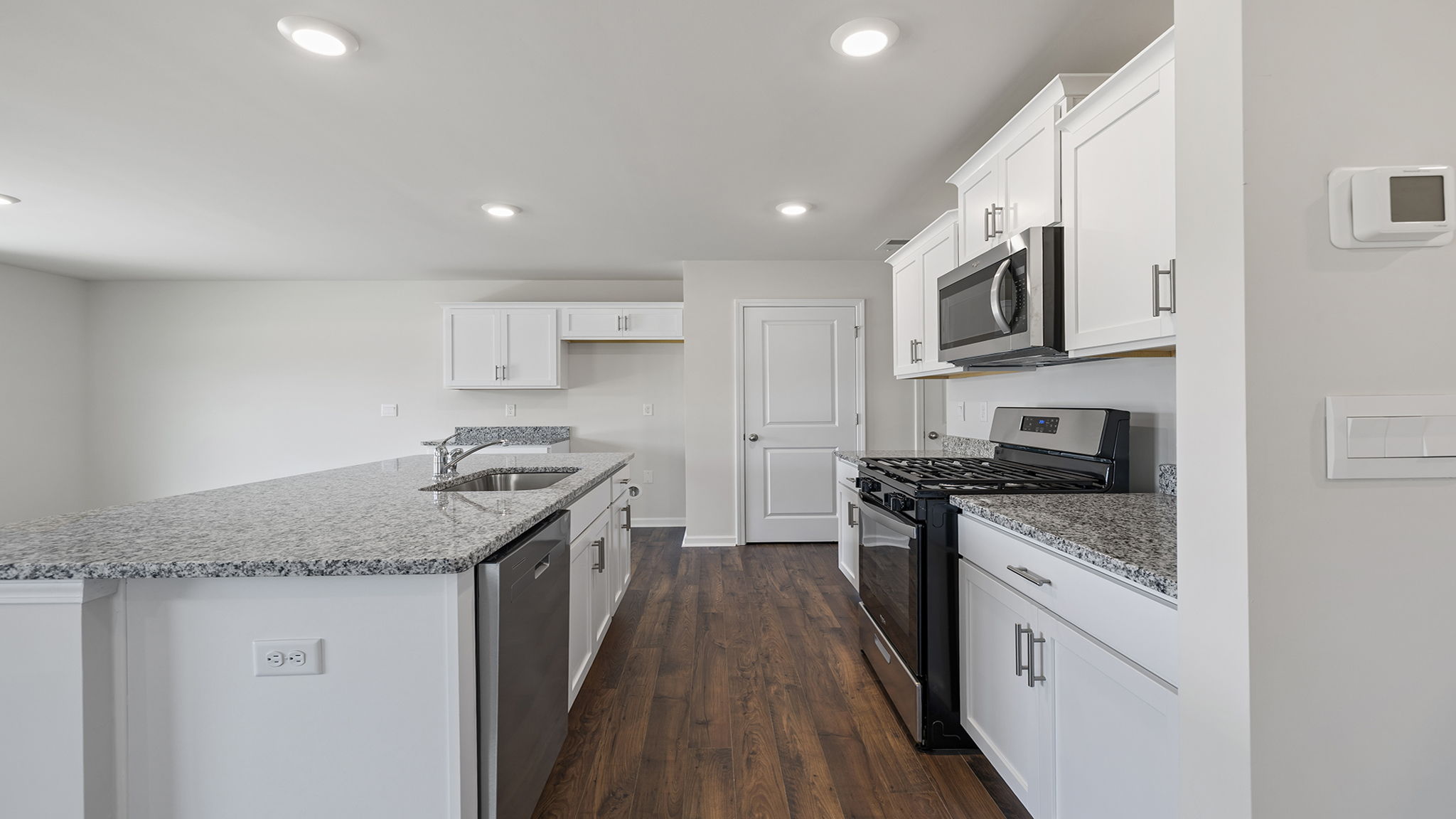Kitchen with island and cabinets.