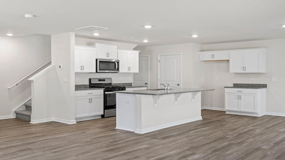 View of open kitchen with island.